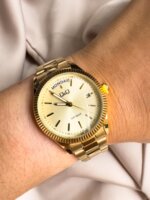 Reloj QYQ dorado en acero